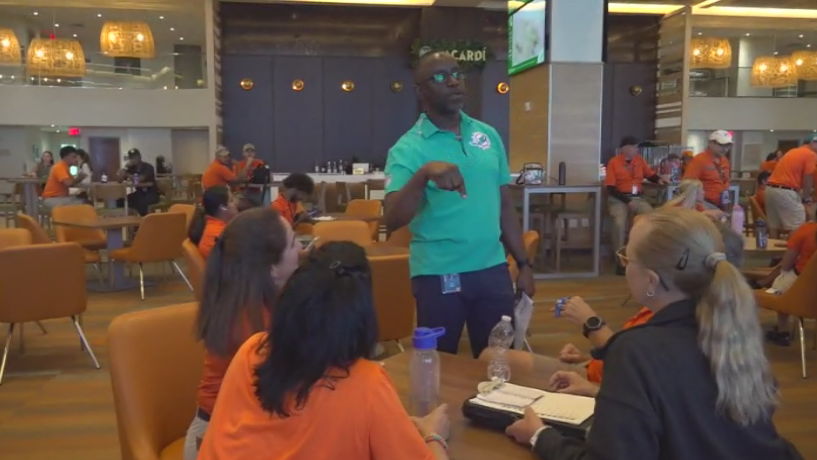 Miami Dade College professor finds his passion with side job at Hard Rock Stadium — CBS Miami, Plano Arts news